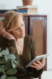 Woman in midlife seeking support for managinge stress and emotional regulation with Calgary therapist on line.